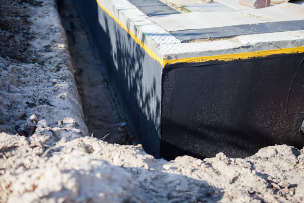 Professional Waterproofing technician working in Concord, VA